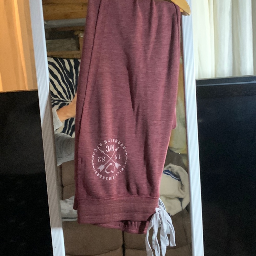 Burgundy skinny leg, fat, jogging pants.